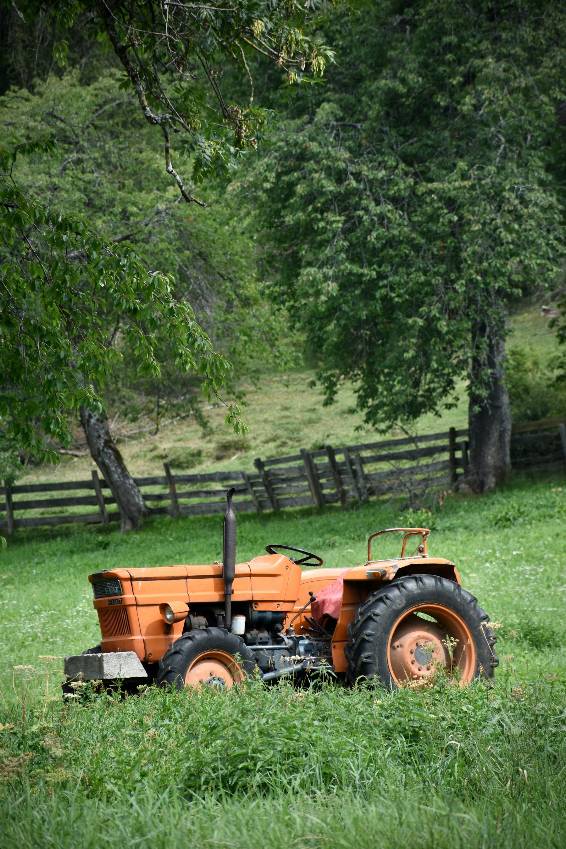 A tractor working beneath a ridgeline